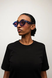 Ottica Mondello Roma - Paloceras - pebble-ice-blue-dx - PEBBLE - ICE BLUE DX - Acetate - shape Cat-eye - blue - EYEWEAR - SUNGLASSES - Unisex,Uomo,Donna,Women,Men - lens red - Made In China